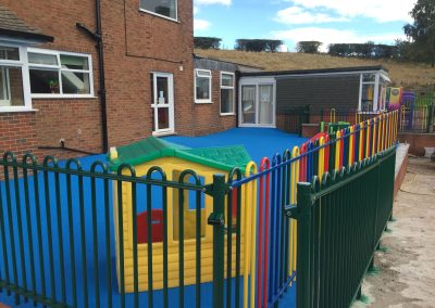 0ABEE3FB-6475-40F2-ACA1-3E51E312ED03 Play area surfacing blue and fencing