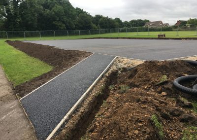 9FB54627-C35D-401D-85E0-F419C2DDCA17 Asphalt surfacing and kerb laying.