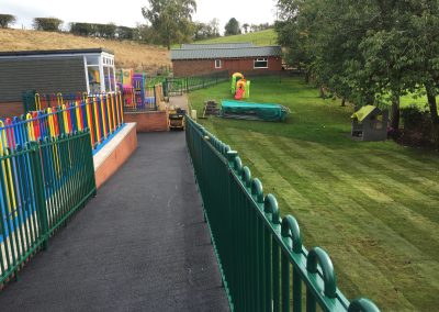 A3EF9125-0EA3-475F-836B-B3CA370A7FAF Civils and groundworks. Play area blue coloured surfacing, asphalt and coloured fencing.