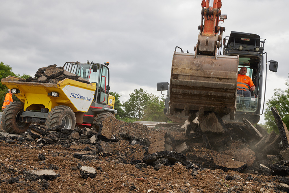 MAC plant machinery carrying out groundwork for the installation of the 3G pitch for Sandy Secondary School