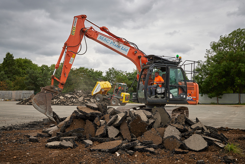 MAC plant machinery carrying out groundwork for the installation of the 3G pitch for Sandy Secondary School
