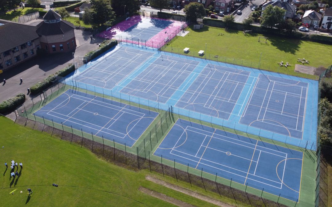 Aerial view of outdoor multi-use sports courts resurfaced and repaired at Chesterfield High School, Liverpool.