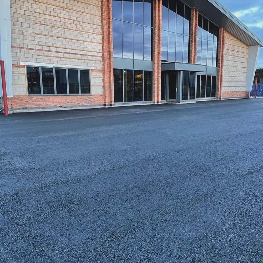 MAC Groundwork Contractors Surfacing Specialists in Asphalt for Commercial Forecourts Civils and groundworks, finishing concrete foundations for commercial site at Bet365 Stadium, Stoke-on-Trent.