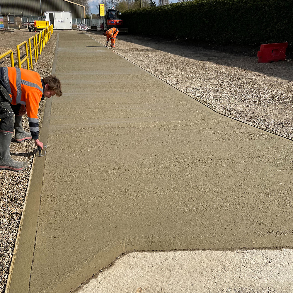 Concrete track laid in a yard area.