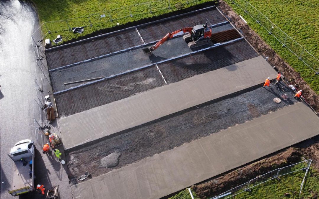 Installation of heavy duty concrete slab with machinery by MAC Groundworks