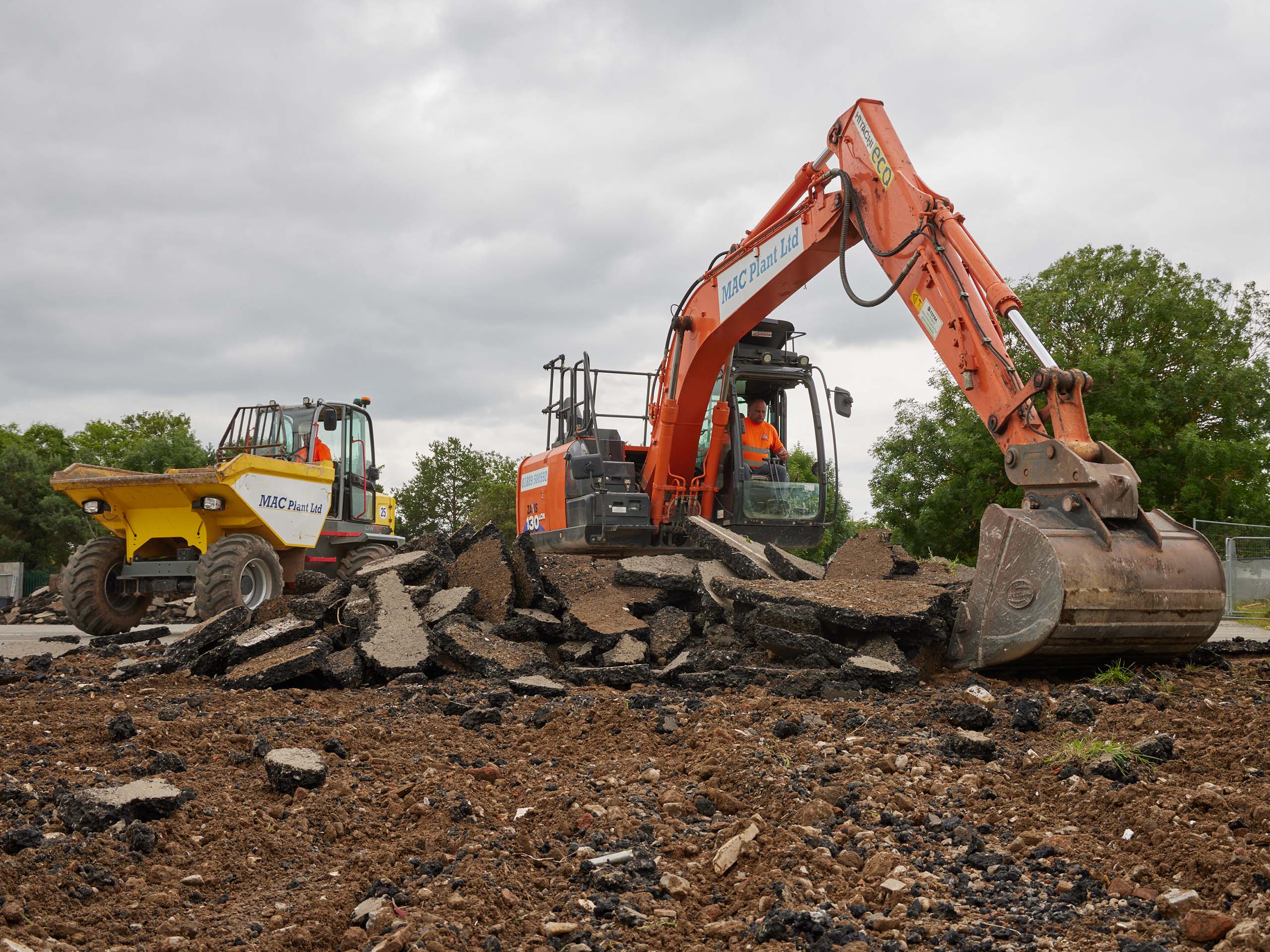 Digger and dumper carrying out excavation work on site for a MAC Groundworks project.